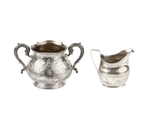 A mid Victorian silver twin handled sucrier, of baluster form, with shaped and beaded borders and scroll handles, engraved wi