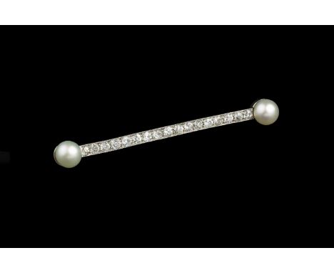 A cultured pearl and diamond bar brooch, the millegrained bar of uniform old-cut diamonds terminating with a pair of cultured
