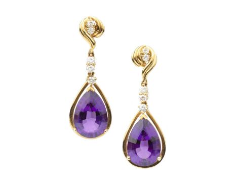 A pair of amethyst and diamond ear pendants, each pear-shaped mixed-cut amethyst drop surmounted by a trio of round brilliant
