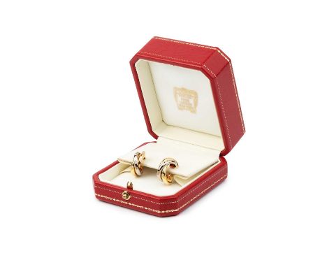 A pair of diamond set 'Trinity' ear hoops by Cartier, each designed as a trio of three colour gold entwined hoops, accented w