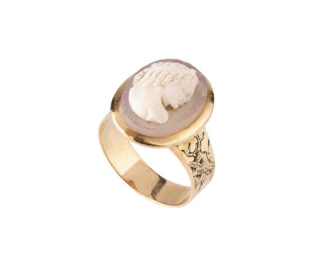 A hardstone cameo ring, the oval cameo carved to depict a classical portrait profile, to a slightly tapered band with engrave