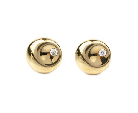A pair of diamond set ear studs designed by Elsa Peretti for Tiffany &amp; Co., each concave panel accented with a round bril