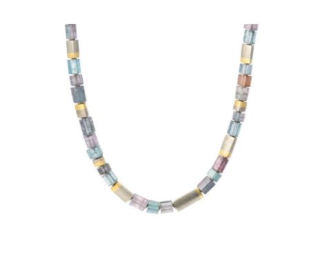 A tourmaline crystal necklace by Louise O'Neill, designed as a single strand of tourmaline crystals in shades of blue, purple