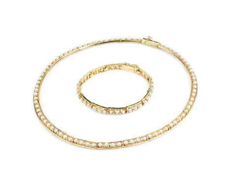 A cultured pearl collar necklace and bracelet suite, each of articulated design, centred with a row of uniform cultured pearl