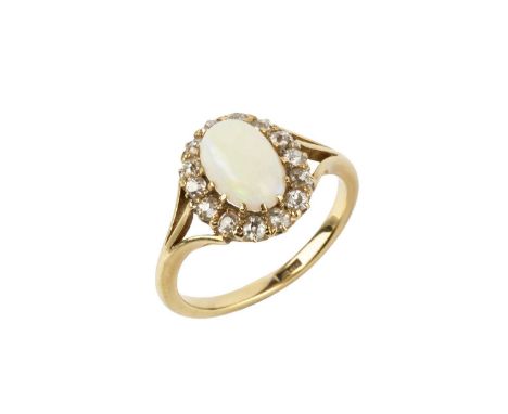 An opal and diamond cluster ring, the oval cabochon opal claw set within a border of old-cut diamonds, yellow precious metal 