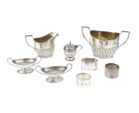 A small collection of silver, comprising a late Victorian half-lobed twin handled sucrier, and matching milk jug, marks worn,