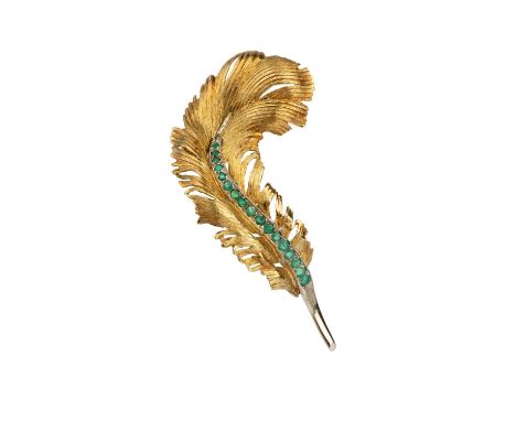 An emerald panel brooch, naturalistically modelled as an undulating feather, with textured decoration, highlighted with a lin