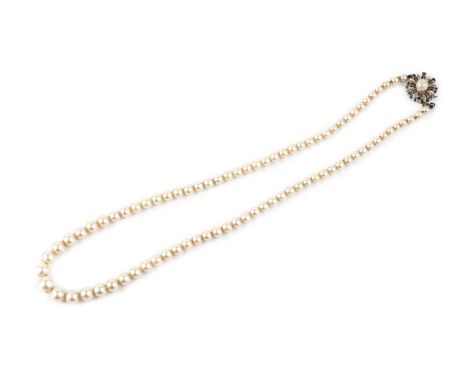 A cultured pearl necklace with gem set clasp, the single strand of graduated cultured pearls to an 18ct white gold flowerhead