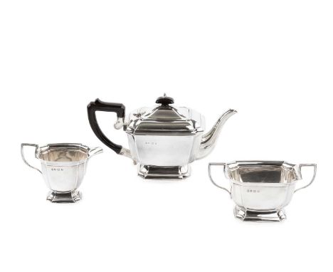 A George VI silver three piece tea service, of shaped rectangular outline, with ebonised handle and knop, by Northern Goldsmi