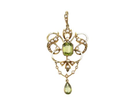 An early 20th century enamel and peridot pendant, the openwork scrolled cartouche centred with an octagonal step-cut peridot,