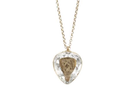 A hairwork memorial pendant on chain, the heart-shaped panel containing plaited hairwork below a faceted rock crystal cover, 