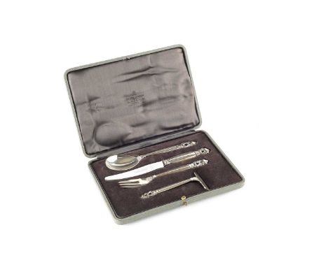 A Danish silver acorn pattern four piece christening set, by Georg Jensen, comprising knife with steel blade, fork, spoon and