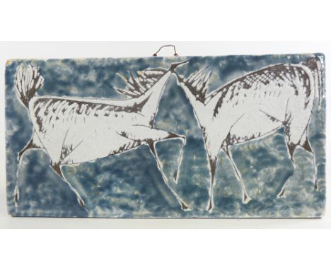 A Scandinavian mid-century ceramic wall plaque, with abstract horse design, length 49cm.Surface dirt and crazing, no cracks, 