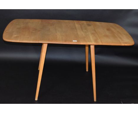 Mid-century Ercol light oak drop leaf dining table with four chairs (two pairs), table 137cm wide fully extended