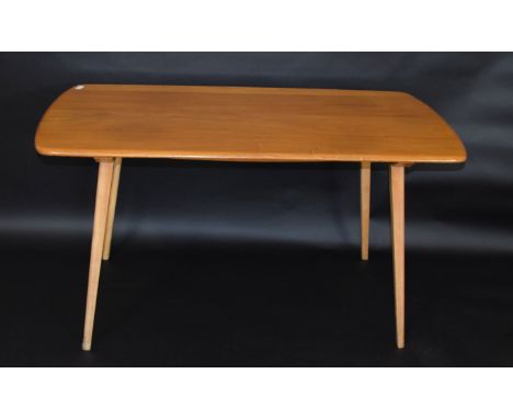 Mid-century light oak Ercol table and six chairs (two carvers), table 137cm wide