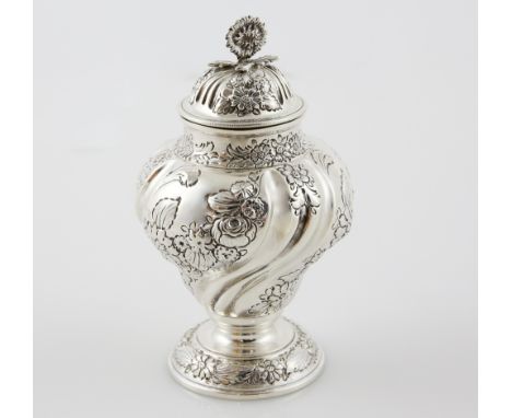 Victorian silver fluted tea caddy and cover embossed with flowers, with sunflower finial, on round foot, by Charles Stuart Ha