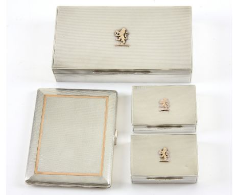 George V silver cigarette and match box set, each with engine turned decoration and lion rampant motif to cover, by Garrard &