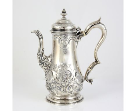 George II silver coffee-pot, the tapering body embossed with flowers and scrolls, the handle with ivory insulators, probably 