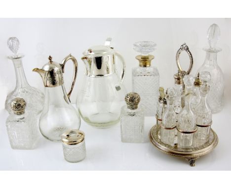 Group of silver plated items to include a cruet set, three decanters including one with a silver mount, two jugs, a selection