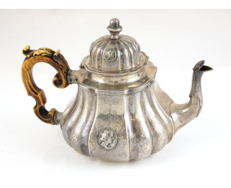 Victorian silver teapot, by WC probably William Chawner II, London 1845, the bulbous lobed body chased with scrolls and with 