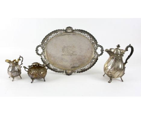 Late 19th century German silver four piece tea service, comprising tea pot, cream jug, sugar bowl and tray, with shell and sc