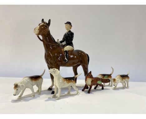 A Beswick Fox hunting group, to comprise horse and rider, four hounds and fox