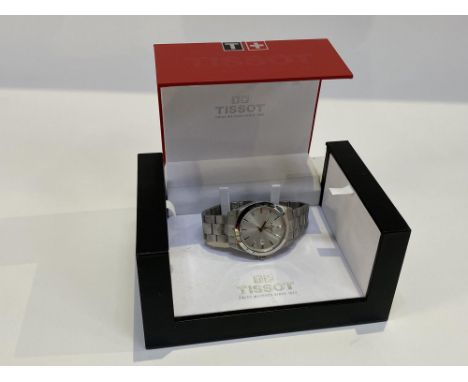 A boxed Gents Tissot watch