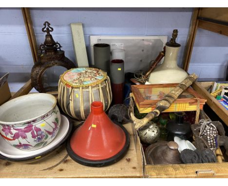 A shelf of various ceramics and glass, to include a red coloured tagine, Tabla drum, Eastern style lantern and vases