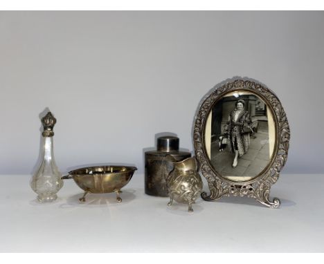 A silver tea caddy and a Birmingham silver bowl, weight 5.2oz/163 grams, a Continental cream jug, decorative oval mirror and 