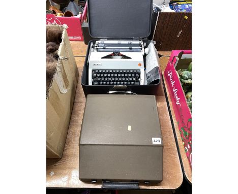 An Olympia typewriter with case, and another