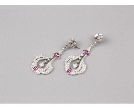 Each Earring with a central openwork diamonds drop together with baguette cut vivid light rubies. Platinum frame and hookWeig