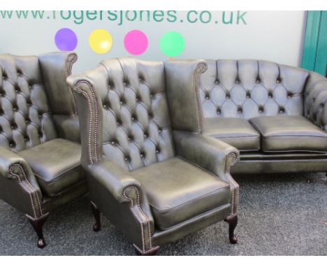 THREE PIECE LOUNGE SUITE - presumed leather and little used consisting of button backed three seater sofa and a pair of match