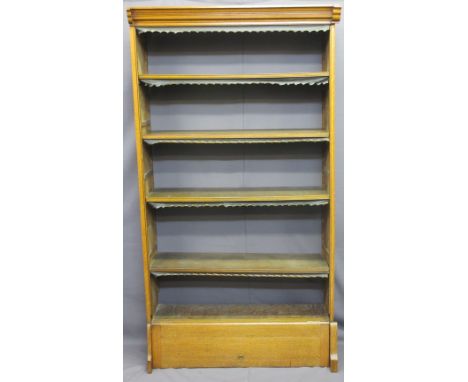 VICTORIAN OAK OPEN BOOKCASE with shaped cornice, interior adjustable shelves and lift-up lower cupboard section bearing label