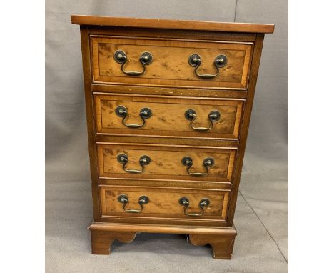 REPRODUCTION YEW WOOD FOUR DRAWER CHEST, neatly proportioned with swan neck handles and cross-banded drawer detail on corner 
