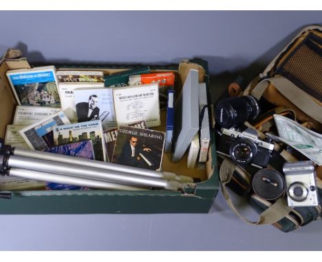 OLYMPUS 35M CAMERA, Tamron lense, Miranda carry case, tripod and a quantity of reel recordings