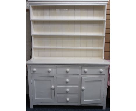 LATE VICTORIAN PAINTED PINE DRESSER having a three shelf rack over a T arrangement of three frieze and three blind drawers wi