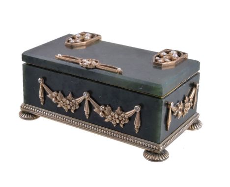 A Continental silver coloured gilt, diamond set and nephrite box, bearing pseudo Russian hallmarks including that of Fabergé,