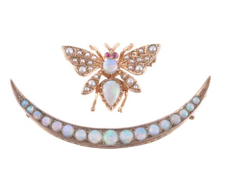 A 9 carat gold opal, seed pearl and ruby bee brooch, the body set with a pear and circular cabochon opal, the wings set with 