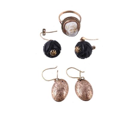 A shell cameo ring, the oval shell cameo carved with a lady's profile, stamped 375, finger size K 1/2; a pair of carved jet e