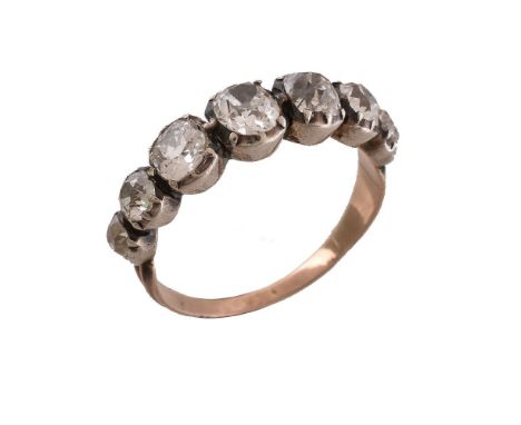 An early 19th century diamond ring, circa 1830, set with graduated oval old cut diamonds, approximately 1.50 carats total, to