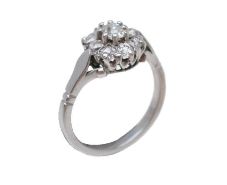 A diamond cluster ring, the old cut diamonds in claw settings, approximately 0.46 carats total, finger size K, 3.1g gross