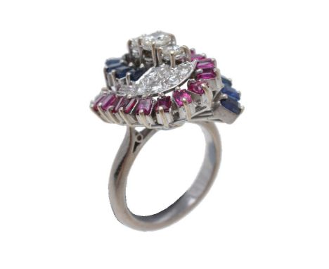 A 1960s diamond, sapphire and ruby dress ring, the central row of three graduated old cut and brilliant cut diamonds set abov