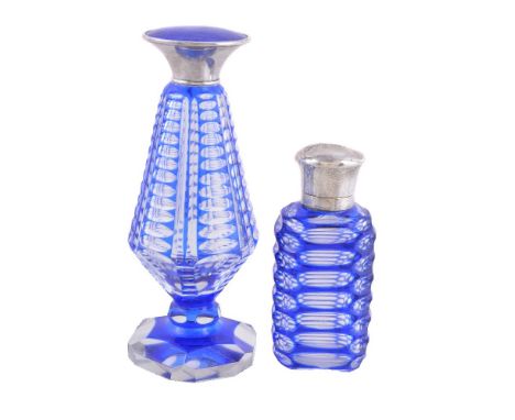 Two blue flash glass scent bottles, the first German and tapered, stamped 925 and D.R.G.M. only, the silver coloured cover bl