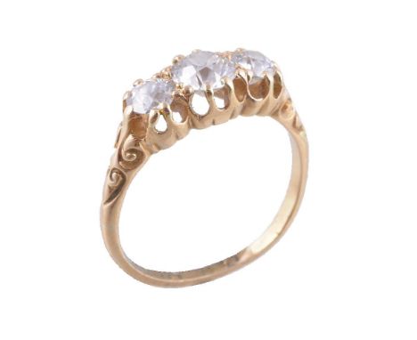 A late Victorian three stone diamond ring, the graduated old brilliant cut diamonds in claw settings, approximately 0.94 cara