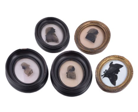 Attributed to Hinton Gibbs, four portrait silhouettes reverse painted on glass, a pair later inscribed in ink verso for membe