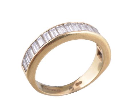 An 18 carat gold diamond half eternity ring, the channel set baguette cut diamonds, approximately 1.44 carats total, 18 carat