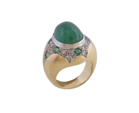 An emerald and diamond dress ring, the oval cabochon emerald collet set within a surround of oval cut emeralds and brilliant 