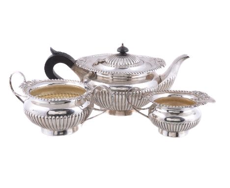 A matched silver compressed spherical three piece tea service, the cream jug and sugar basin by I. S. Greenberg &amp; Co., Bi