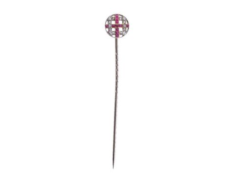 A 1920s ruby and diamond stickpin, the circular pierced lattice panel set with old cut diamonds and French cut rubies, panel 