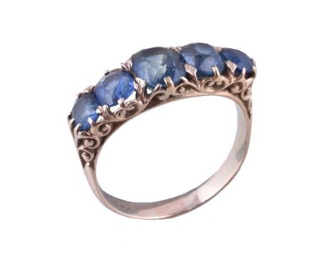 A sapphire five stone ring, the graduating oval cut sapphires in claw settings, finger size R